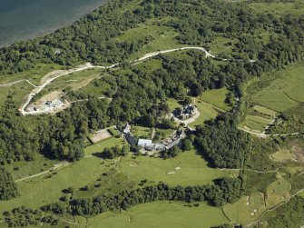 Oblique aerial view centred on the hotel, cottage and golf course, taken from the NNE.