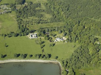Oblique aerial view centred on the country house and farmsteading, taken from the WSW.