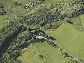 Oblique aerial view centred on the tower-house, taken from the SSE.