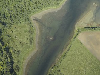 Oblique aerial view centred on the remains of the crannog, taken from the W.