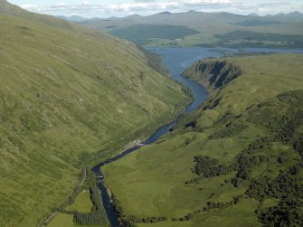 General oblique aerial view of the Pass of Bander, centred on the barrage, the remains of the fort and the course of the military road, taken from the W.
