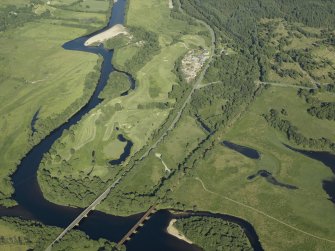 General oblique aerial view centred on the railway viaduct and road bridge with the sawmill adjacent, taken from the WNW.