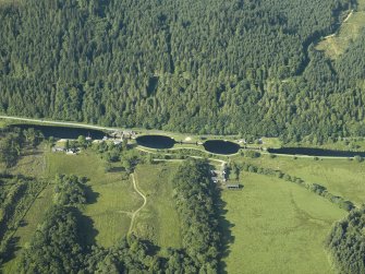 Oblique aerial view centred on the canal basins, locks, and bridge, taken from the NE.