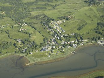 General oblique aerial view of the village, centred on the hotel and the church, taken from the SE.