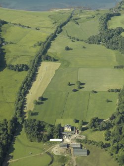 General oblique aerial view with the country house in the foreground, taken from the NE.