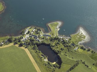 General oblique aerial view centred on the village of Toberonachy with the remains of the slate quarry adjacent, taken from the WSW.