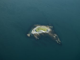Oblique aerial view centred on Fladda lighthouse in the Firth of Lorne, taken from the NE.