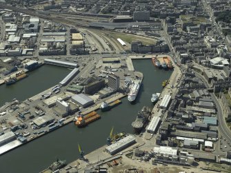 Scanned image of an olique aerial view centred on the dock, warehouse and works, taken from the NE.