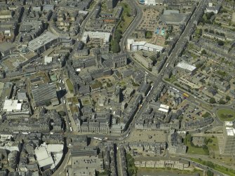 General oblique aerial view centred on the friary, colleges, hospital, churches, tolbooth and cathedral, taken from the ENE.