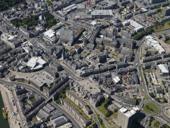 General oblique aerial view centred on the friary, colleges, hospital, churches, tolbooth and cathedral, taken from the E.