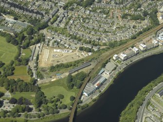 Oblique aerial view centred on the railway engine shed and turntable, taken from the SE.