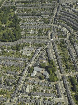 Oblique aerial view centred on the church, manse and the house, taken from the WSW.