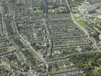 General oblique aerial view of the Rosemount area of the city centred on the church, taken from the E.