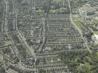 General oblique aerial view of the Rosemount area of the city centred on the church, taken from the E.