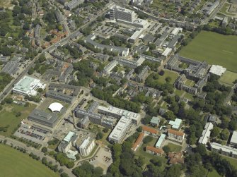 General oblique aerial view centred on the university colleges, offices and halls of residence, taken from the SW.