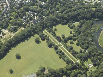 Oblique aerial view centred on the cathedral, burial ground and park, taken from the NE.