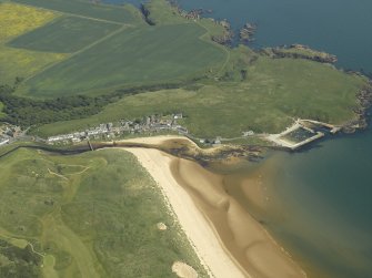 General oblique aerial view centred on the village and the harbour, taken from the WSW.