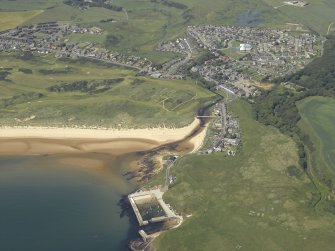 General oblique aerial view centred on the villages and harbour, taken from the SE.