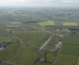 General oblique aerial view centred on the airfield, taken from the ENE.