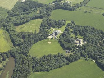 Oblique aerial view centred on the country house, stable block and walled garden, taken from the NNW.