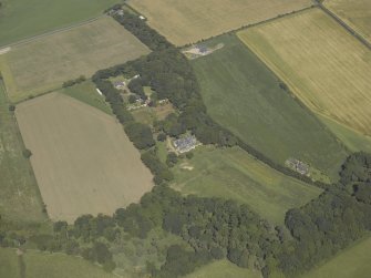 Oblique aerial view centred on the country house, house and walled garden, taken from the SSW.