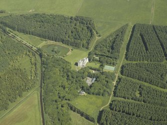 Oblique aerial view centred on the tower-house and walled garden, taken from the W.