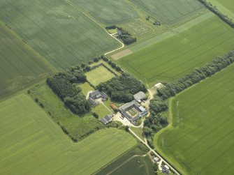Oblique aerial view centred on the country house and garden, taken from the NE.