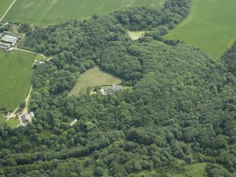 Oblique aerial view centred on the country house with the house adjacent, taken from the N.