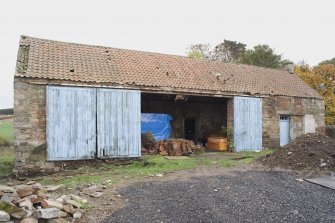 Building to SE of steading, view from W showing sliding doors for machinery access.