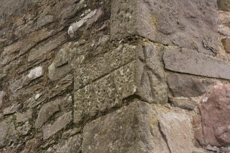 Building to SE of steading, detail of carved stone set into NE corner