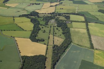 General oblique aerial view centred on the country house, gardens, stables, farmsteading and gate-lodges, taken from the SSE.