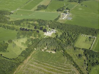 Oblique aerial view centred on the castle, country house and walled garden with the sawmill adjacent, taken from the ESE.