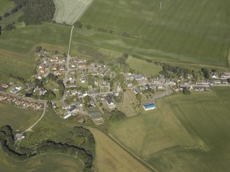 General oblique aerial view of the village, centred on the church and the burial ground, taken from the ESE.