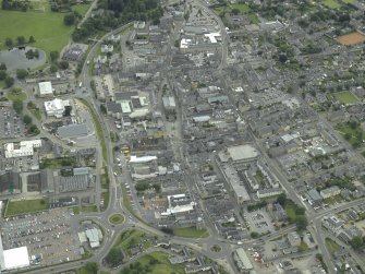 General oblique aerial view of the town centred on the church, taken from the W.