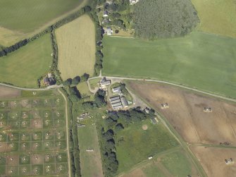 Oblique aerial view centred on the watermill and house with the pig farm adjacent, taken from the ENE.