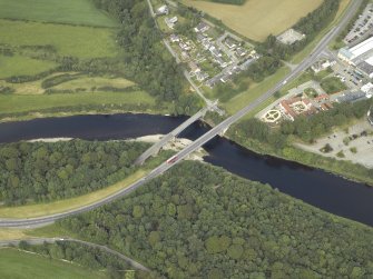 Oblique aerial view centred on the road bridges and tollhouse, taken from the E.