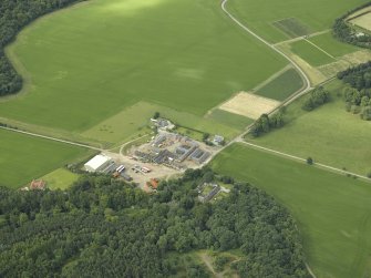General oblique aerial view centred on the farmsteading, farmhouse and kennels, taken from the NE.