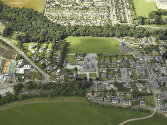 Oblique aerial view centred on the school, taken from the NE.