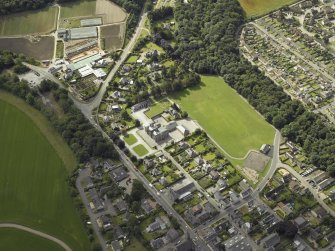 Oblique aerial view centred on the school, taken from the NNW.