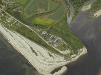 Oblique aerial view centred on the fishing station, ice-house, farmhouse and farmsteading, taken from the NNW.