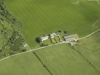 Oblique aerial view centred on the church, taken from the SW.