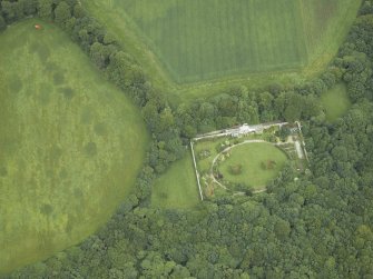 Oblique aerial view centred on the walled garden and cottage, taken from the SW.