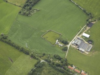 Oblique aerial view centred on the house and walled garden, taken from the NW.