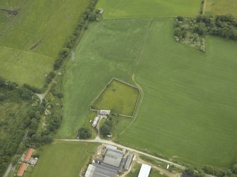 Oblique aerial view centred on the house and walled garden, taken from the WSW.