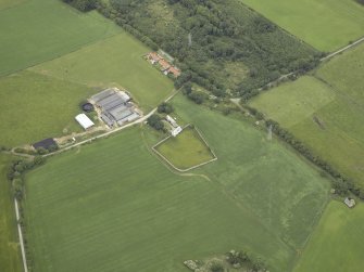 Oblique aerial view centred on the house and walled garden, taken from the ESE.