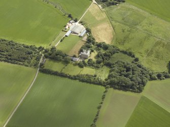 Oblique aerial view centred on the country house, walled garden, lodge, farmhouse and farmsteading, taken from the WSW.