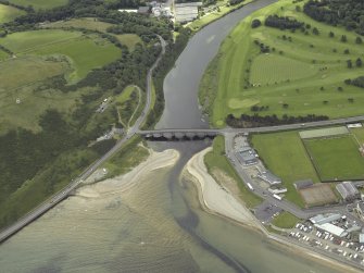 Oblique aerial view centred on the road bridge, taken from the NNW.