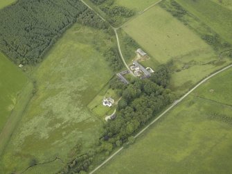 Oblique aerial view centred on the tower-house, farmhouse and farmsteading, taken from the SE.