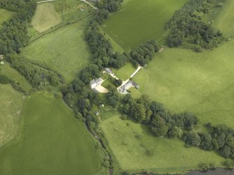 Oblique aerial view centred on the castle and the dovecot, taken from the SSW.