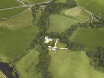 Oblique aerial view centred on the castle and the dovecot, taken from the SE.